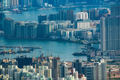 High angle view of river and buildings in city