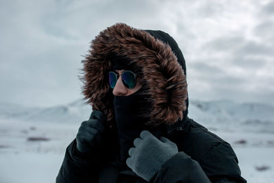 Portrait of person wearing hat during winter