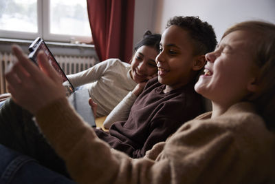 Children using digital tablet at home