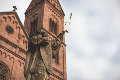 Low angle view of statue against sky