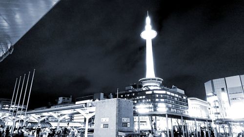 Low angle view of illuminated buildings at night