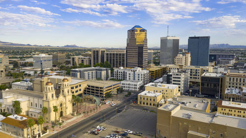 High angle view of buildings in city against sky