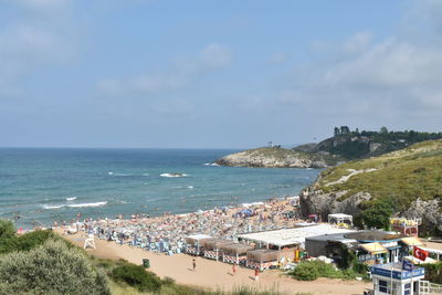 High angle view of sea and buildings against sky