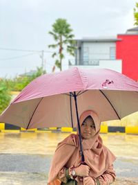 Portrait of man in rain