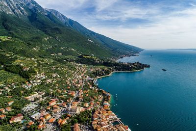 Aerial view of sea against cloudy sky