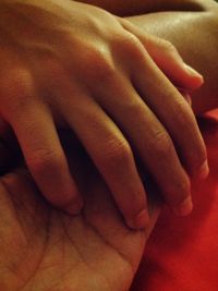 Close-up of hand touching midsection