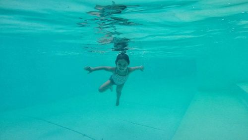 Boy swimming in pool