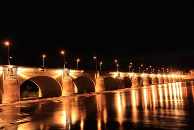 Reflection of illuminated buildings in water