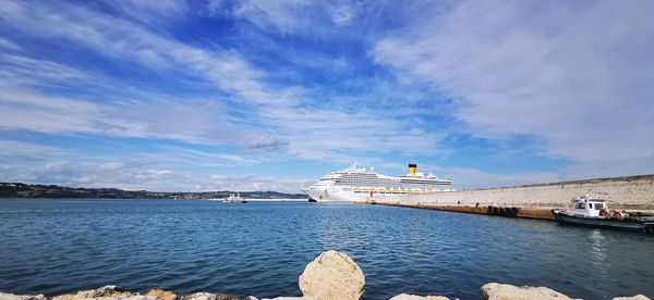 Scenic view of sea against cloudy sky