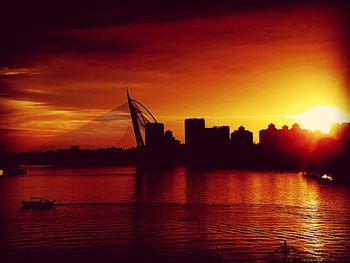 Silhouette of buildings at waterfront