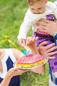 Midsection of woman holding ice cream