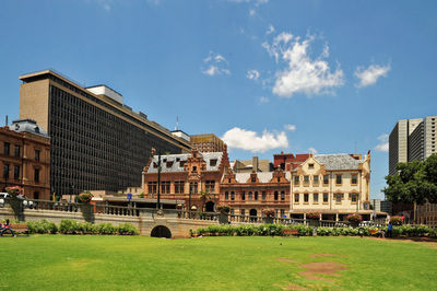 Buildings in city against sky