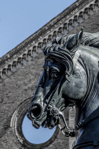 Low angle view of statue against sky