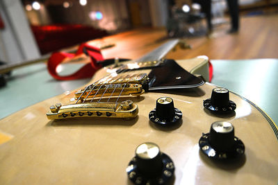 High angle view of guitar on table