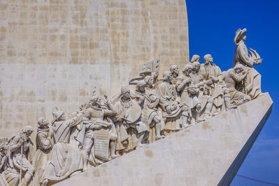 Low angle view of statues on wall