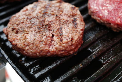 Close-up of meat on barbecue grill