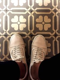 Low section of man standing on floor