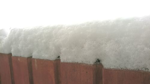 Wet sand against sky