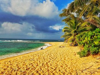 View of beach against cloudy sky