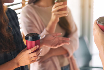 Close-up of woman holding drink