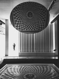 Man in corridor of building