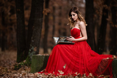 Beautiful young woman in forest