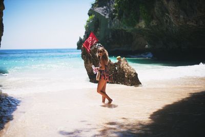 Woman standing on beach