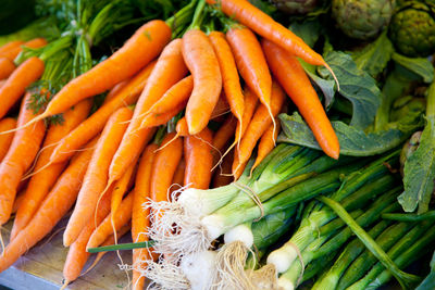 Close-up of scallions and carrots at market