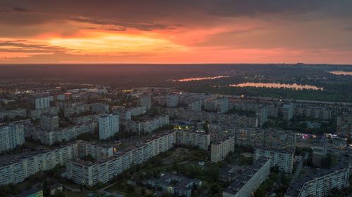 High angle view of buildings against sky during sunset