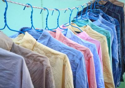 Close-up of clothes hanging in store