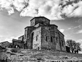 Low angle view of old church against sky