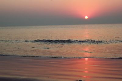 View of calm sea at sunset