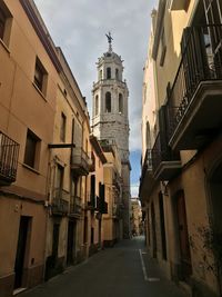 Low angle view of buildings against sky in spain 