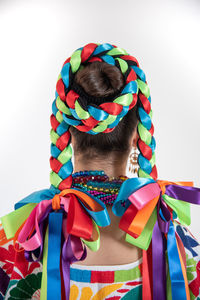 Rear view of woman with multi colored background