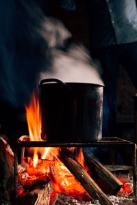 Close-up of food getting cooked on wood burning stove