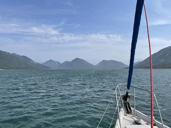 Sailboat in sea against sky