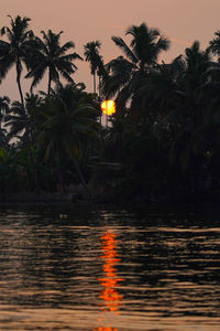 Scenic view of swimming pool against sky during sunset