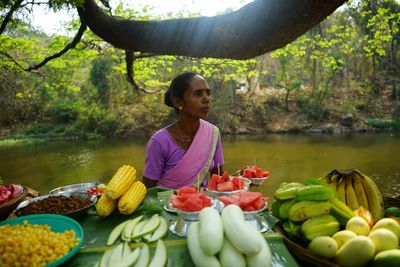 Full length of woman eating in water