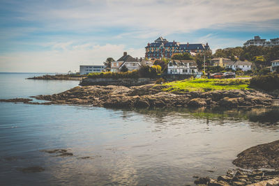 View of sea with buildings in background