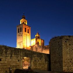 Low angle view of old building against sky at night