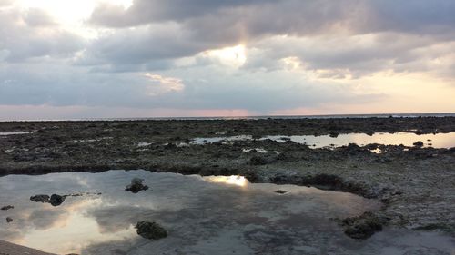 Scenic view of sea against sky at sunset