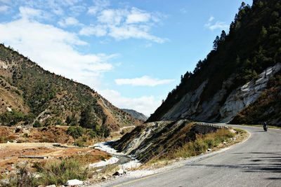 Scenic view of river by mountains against sky at bomdila