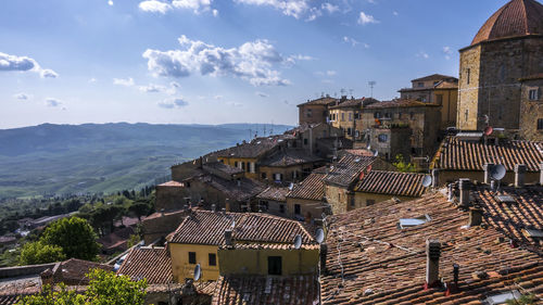 Houses in city against sky