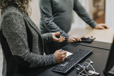 Woman's hands near keyboard