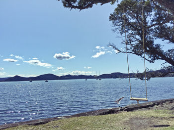 View of calm lake against mountain range