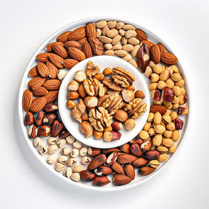 Directly above shot of beans in bowl on white background