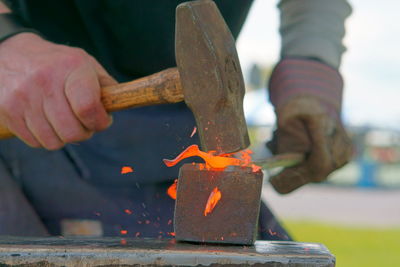Close-up of man working on wood