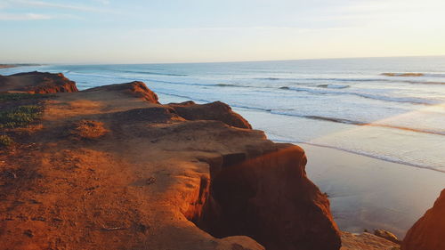 Scenic view of sea against sky on sunny day