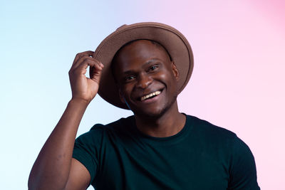 Portrait of young man against white background