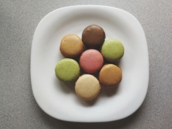 Close-up of multi colored candies in plate